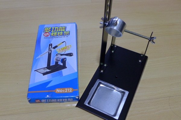 Vertical soldering iron stand with solder reel